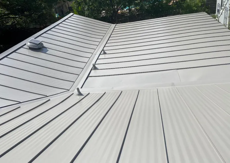 Solar attic fan installed on a metal roof for Roof Ventilation in Wilton Manors